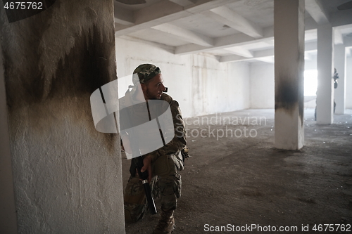 Image of military troops in action urban environment