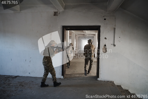 Image of military troops in action urban environment