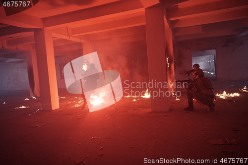 Image of military troops in action urban environment