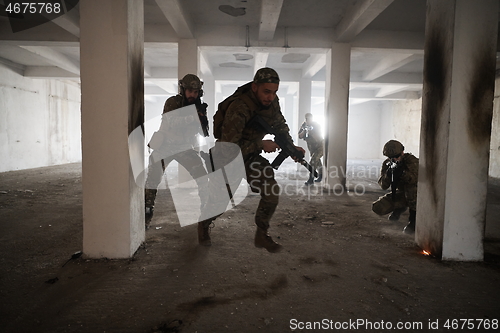 Image of military troops in action urban environment