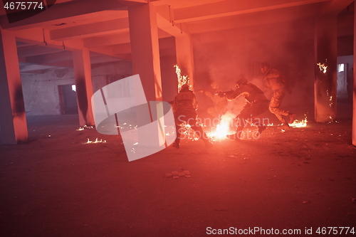 Image of military troops in action urban environment