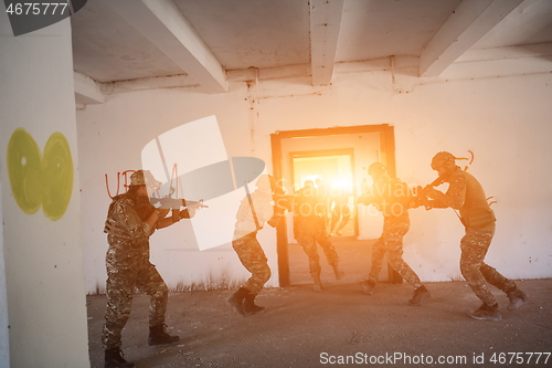 Image of military troops in action urban environment