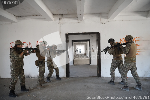 Image of military troops in action urban environment