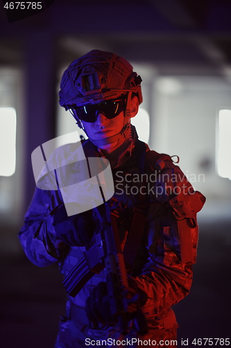 Image of soldier squad team portrait in urban environment colored lightis