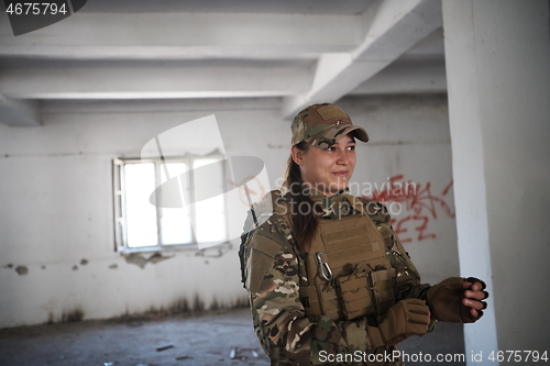 Image of military female soldier having a break