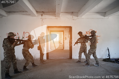 Image of military troops in action urban environment