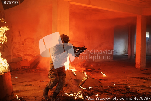 Image of military troops in action urban environment