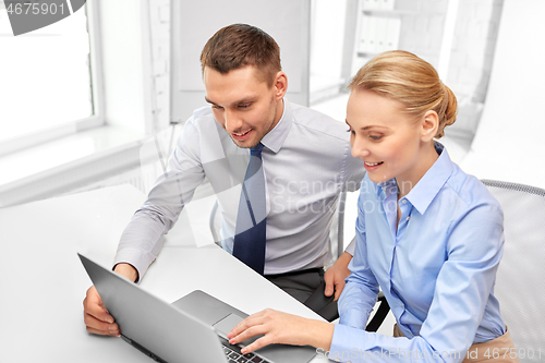 Image of business team with laptop at office