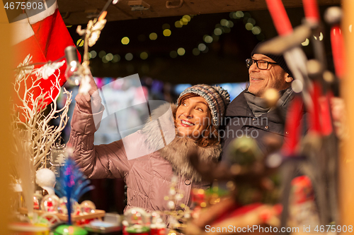 Image of senior couple at christmas market souvenir shop