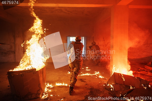 Image of military troops in action urban environment