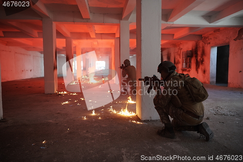 Image of military troops in action urban environment