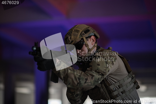 Image of modern warfare soldier in urban environment battlefield