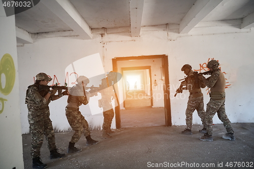 Image of military troops in action urban environment