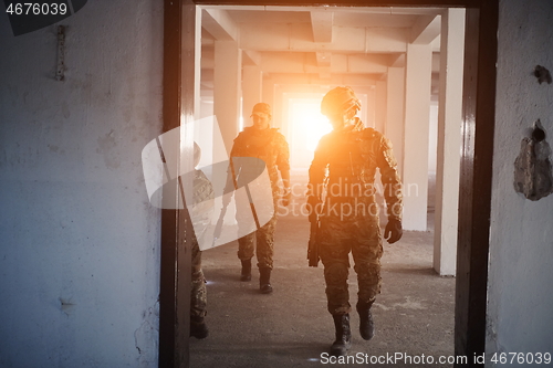 Image of military troops in action urban environment