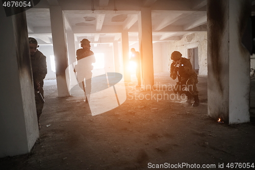 Image of military troops in action urban environment