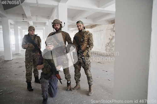 Image of soldier squad team portrait in urban environment