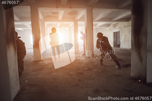 Image of military troops in action urban environment