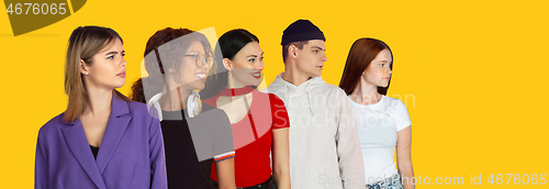 Image of Portrait of young people on bright yellow studio background, collage