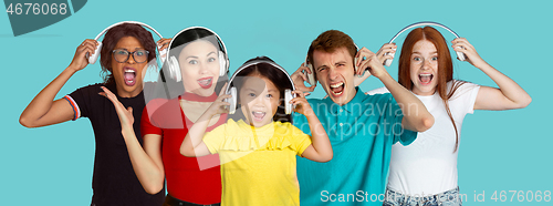 Image of Portrait of young people on light blue studio background, collage