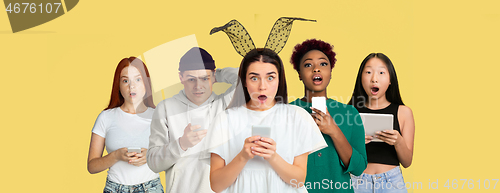 Image of Portrait of young people on bright yellow studio background, collage