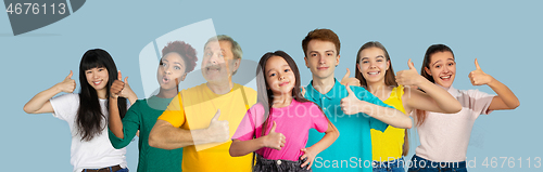 Image of Portrait of young people on light blue studio background, collage