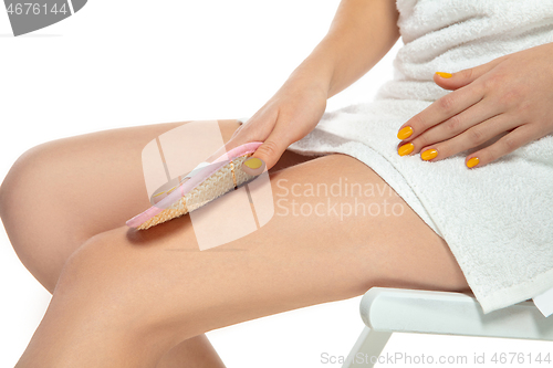 Image of Beautiful female legs isolated on white background. Beauty, cosmetics, spa, depilation, diet, treatment and fitness concept