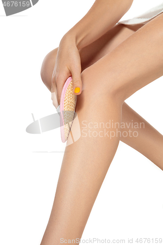 Image of Beautiful female legs isolated on white background. Beauty, cosmetics, spa, depilation, diet, treatment and fitness concept