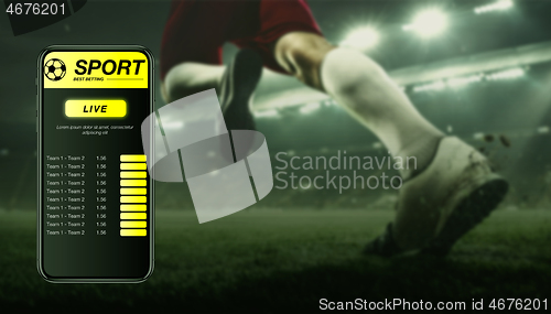 Image of Smartphone screen with mobile app for betting and score, sportsman on background