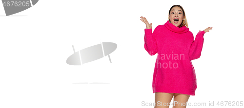 Image of Beautiful young woman in bright pink comfortable sweater, long sleeve isolated on white studio background