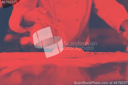 Image of chef hands preparing dough for pizza