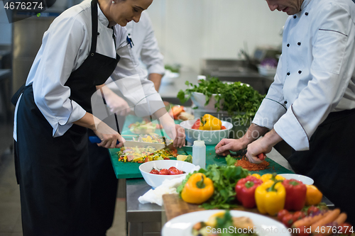 Image of team cooks and chefs preparing meals