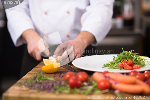 Image of chef serving vegetable salad