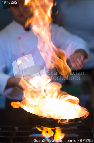 Image of Chef doing flambe on food