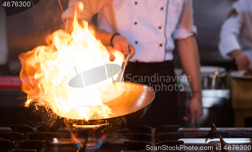 Image of Chef doing flambe on food