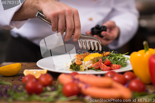 Image of chef serving vegetable salad