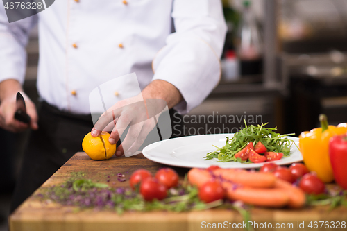 Image of chef serving vegetable salad