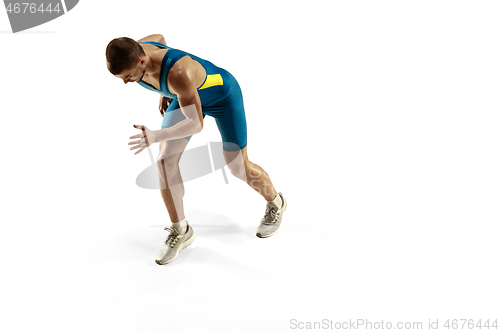 Image of Young caucasian man running or jogging isolated on white studio background.