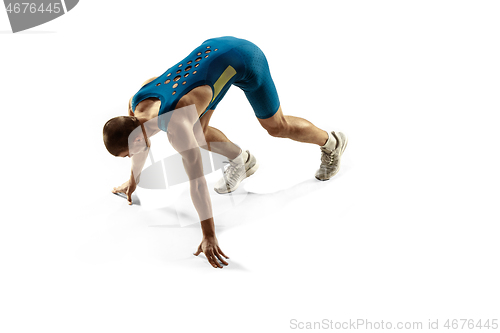 Image of Young caucasian man running or jogging isolated on white studio background.