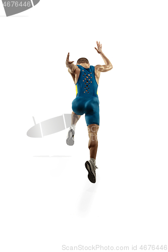 Image of Young caucasian man running or jogging isolated on white studio background.