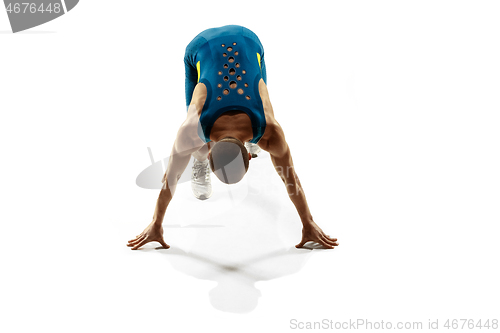 Image of Young caucasian man running or jogging isolated on white studio background.