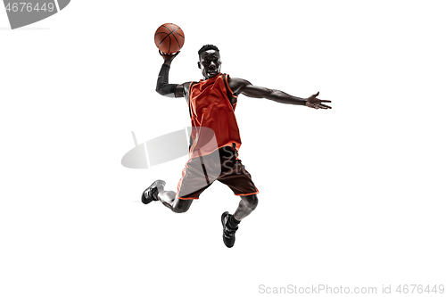 Image of Full length portrait of a basketball player with ball