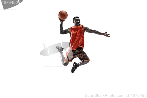 Image of Full length portrait of a basketball player with ball