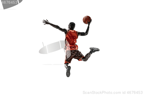 Image of Full length portrait of a basketball player with ball