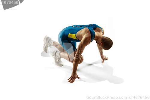 Image of Young caucasian man running or jogging isolated on white studio background.