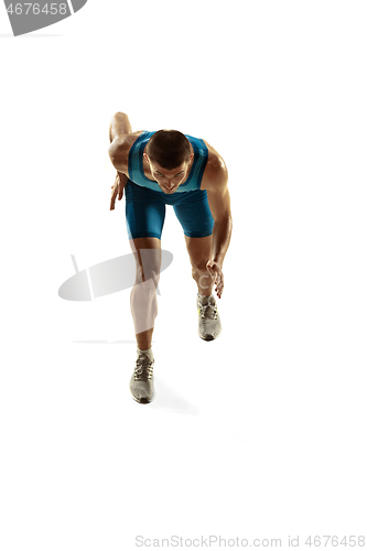 Image of Young caucasian man running or jogging isolated on white studio background.