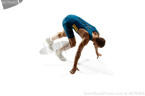 Image of Young caucasian man running or jogging isolated on white studio background.