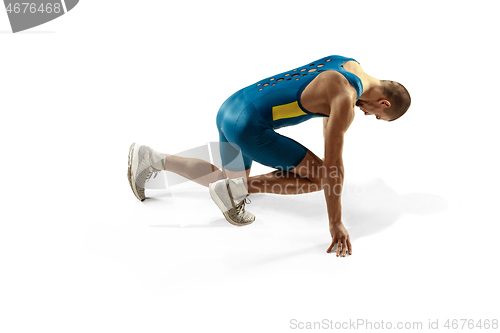 Image of Young caucasian man running or jogging isolated on white studio background.