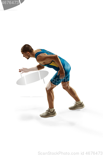 Image of Young caucasian man running or jogging isolated on white studio background.