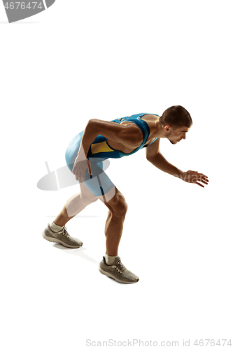 Image of Young caucasian man running or jogging isolated on white studio background.