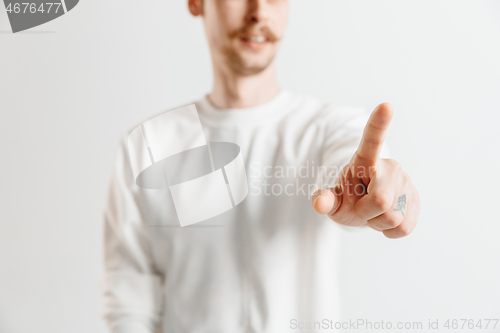 Image of Businessman hand touching empty virtual screen